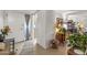 Inviting entryway featuring neutral tones, elegant decor, and seamless flow into the kitchen and dining area at 10801 W Mountain View Rd, Sun City, AZ 85351