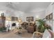 Cozy living room featuring comfortable seating, decorative accents, and a bright, inviting atmosphere at 10801 W Mountain View Rd, Sun City, AZ 85351