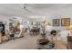 Open-concept living space with dining area, comfortable seating, and ample natural light at 10801 W Mountain View Rd, Sun City, AZ 85351