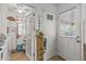 Hallway leading to a mud room area with outside access and ample storage at 10801 W Mountain View Rd, Sun City, AZ 85351