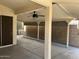 Large covered patio with a ceiling fan, providing a comfortable and shaded outdoor living space at 11207 N 59Th Dr, Glendale, AZ 85304