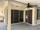 Spacious covered patio with sliding glass doors, offering a perfect spot for outdoor relaxation and entertainment at 11207 N 59Th Dr, Glendale, AZ 85304