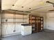 Organized garage with ample shelving, providing plenty of storage space for tools and equipment at 11207 N 59Th Dr, Glendale, AZ 85304