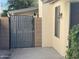 Stylish gray gate with a modern design, providing privacy and security for the property at 11207 N 59Th Dr, Glendale, AZ 85304