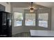 Light filled kitchen nook with a modern ceiling fan and large windows at 11207 N 59Th Dr, Glendale, AZ 85304