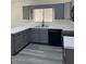 Well lit kitchen featuring gray cabinets, white countertops, and modern appliances at 11207 N 59Th Dr, Glendale, AZ 85304
