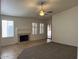 Cozy living room featuring a fireplace, providing a perfect setting for Gathering time and relaxation at 11207 N 59Th Dr, Glendale, AZ 85304