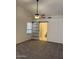 Spacious main bedroom with neutral carpet and barn door access to ensuite bathroom at 11207 N 59Th Dr, Glendale, AZ 85304