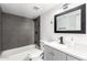 Modern bathroom with shower and tub combination and decorative vanity at 12235 N 36Th Dr, Phoenix, AZ 85029