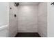 Modern bathroom features a tiled shower, black fixtures, and clean finishes at 12235 N 36Th Dr, Phoenix, AZ 85029