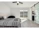 Cozy bedroom with light-colored flooring and a sliding glass door to the backyard at 12235 N 36Th Dr, Phoenix, AZ 85029