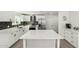 Modern kitchen with stainless steel appliances, quartz countertops, white cabinetry and center island at 12235 N 36Th Dr, Phoenix, AZ 85029