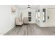 Bright living room featuring sleek laminate flooring, neutral tones, and modern furnishings at 12235 N 36Th Dr, Phoenix, AZ 85029