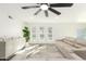 Inviting living room showcasing neutral decor, laminate flooring, and bright, natural light through multiple windows at 12235 N 36Th Dr, Phoenix, AZ 85029
