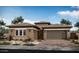 Charming single-story home featuring a modern design, a two-car garage and professionally landscaped yard at 1416 E Cherrywood Pl, Chandler, AZ 85249