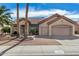 Inviting home exterior with well-maintained landscaping and a three car garage at 14621 W Black Gold Ln, Sun City West, AZ 85375