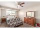 Cozy bedroom features a decorative bench, wood furniture, and natural light at 1575 W Hazelwood St, Phoenix, AZ 85015