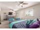 Spacious primary bedroom with dual ceiling fans, bright windows, and ample space for furniture at 1575 W Hazelwood St, Phoenix, AZ 85015