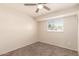 Empty carpeted bedroom has a small window and a closet at 1575 W Hazelwood St, Phoenix, AZ 85015