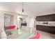Dining area featuring updated light fixture and seating for six at 1575 W Hazelwood St, Phoenix, AZ 85015