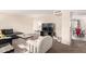Bright living room featuring a large TV, cozy seating, and an open layout for entertaining and relaxing at 1575 W Hazelwood St, Phoenix, AZ 85015