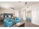 Comfortable main bedroom features plush seating, a decorative mirror, and carpeted floors at 1575 W Hazelwood St, Phoenix, AZ 85015