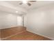 A bedroom featuring modern flooring, neutral paint, and a ceiling fan, offering a comfortable living space at 1919 E Libby St, Phoenix, AZ 85022