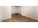 A bright bedroom featuring neutral walls and wood-look flooring, offering a modern aesthetic at 1919 E Libby St, Phoenix, AZ 85022