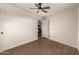 Bedroom with hardwood floors, ceiling fan, and an open door leading to other areas of the home at 1919 E Libby St, Phoenix, AZ 85022