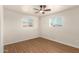 Bedroom featuring two windows and wood-look floors at 1919 E Libby St, Phoenix, AZ 85022