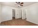 Bedroom with wood-look floors and multiple closets/doorways at 1919 E Libby St, Phoenix, AZ 85022
