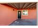 Charming entryway with a covered porch, a decorative door, and a window for natural light at 1919 E Libby St, Phoenix, AZ 85022