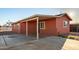 Exterior view showcasing a covered patio and a well-kept facade, perfect for outdoor relaxation at 1919 E Libby St, Phoenix, AZ 85022