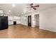 Open-concept living space with an eat-in kitchen and wood-look floors at 1919 E Libby St, Phoenix, AZ 85022