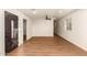 Spacious living room with natural light, modern ceiling fan, and stylish front door at 1919 E Libby St, Phoenix, AZ 85022
