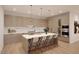Modern kitchen with stainless steel appliances, waterfall island, wine fridge and pendant lighting at 19355 N 73Rd Way # 4016, Scottsdale, AZ 85255