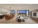 Bright living room and dining area featuring modern decor, mountain views, and hardwood floors at 19355 N 73Rd Way # 4016, Scottsdale, AZ 85255