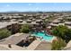 Beautiful aerial view of the community pool and surrounding townhomes, showing the desert landscape at 19777 N 76Th St # 1272, Scottsdale, AZ 85255