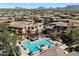 Overhead view of the community amenities, including a pool with lounge seating at 19777 N 76Th St # 1272, Scottsdale, AZ 85255