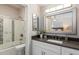 Bright bathroom featuring a shower over tub and vanity at 19777 N 76Th St # 1272, Scottsdale, AZ 85255