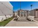 Backyard with patio furniture, turf, and a storage shed at 201 S Greenfield Rd # 254, Mesa, AZ 85206