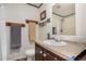 Neat bathroom featuring a vanity with sink, a toilet, and a shower with curtain at 201 S Greenfield Rd # 254, Mesa, AZ 85206