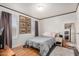 Bright bedroom with wood floors and ample natural light at 201 S Greenfield Rd # 254, Mesa, AZ 85206