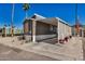 Lovely gray home featuring a covered parking area and charming decorations at 201 S Greenfield Rd # 254, Mesa, AZ 85206