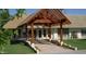 Charming single-story home boasts a covered entryway and lush green landscaping at 201 S Greenfield Rd # 254, Mesa, AZ 85206
