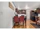 Cozy kitchen with dark wood cabinets, modern appliances, and dining area at 201 S Greenfield Rd # 254, Mesa, AZ 85206
