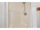 A shower stall with a handheld shower head and white walls at 201 S Greenfield Rd # 254, Mesa, AZ 85206