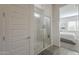 Tiled shower in primary bathroom features a glass door and bench at 2049 W Burnside W Trl, Phoenix, AZ 85085