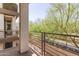 A balcony featuring sturdy railings and a view of lush green trees at 2090 S Dorsey Ln # 1020, Tempe, AZ 85282