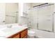 Bathroom with a shower over the bath, a toilet, and a sink with dark wood cabinets at 2090 S Dorsey Ln # 1020, Tempe, AZ 85282